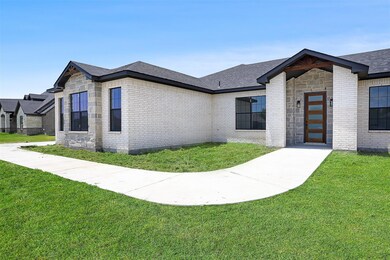 View of front of house with brick siding, a front 