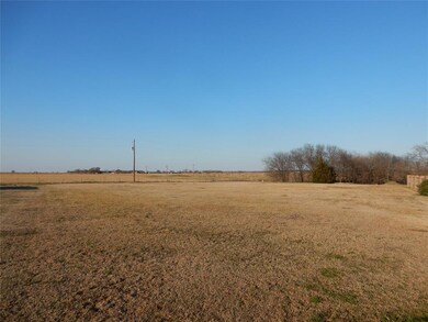 Lot with trees at back