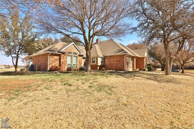 Mature landscaped yard and trees.  Gutters.