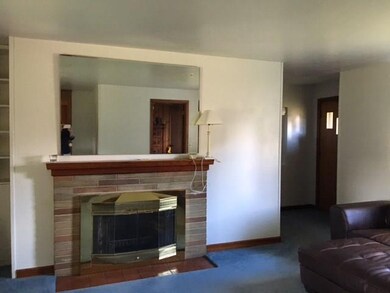 Living room with brick fireplace
