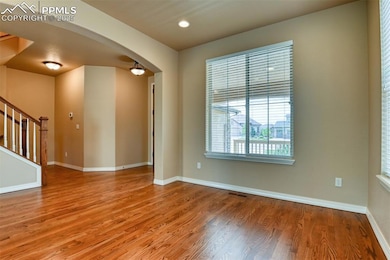Unfurnished room featuring hardwood / wood-style f