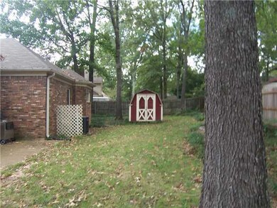 Nice fenced yard w/ storage building