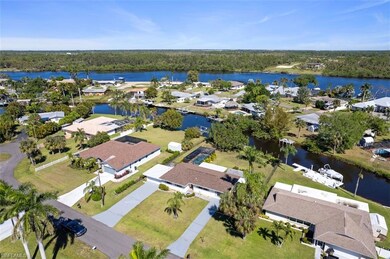 Aerial view of residential area featuring a large body of water