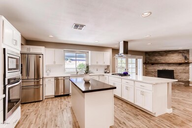Kitchen open to Fireplace