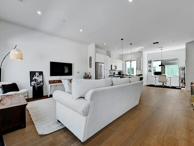 Living room featuring recessed lighting, wood fin