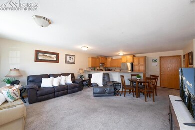 Living room featuring light colored carpet