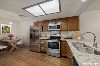 Kitchen featuring stainless steel appliances, a t