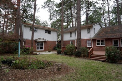 A back yard view of the main house( right) and the