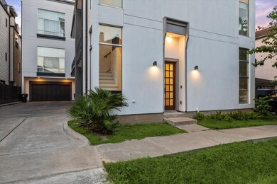 A modern welcome with timeless curb appeal—this sl