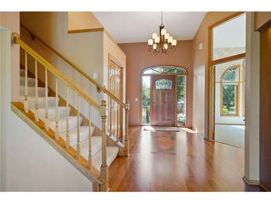 Spacious foyer with inlet wood floor