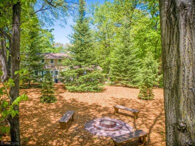 Beyond the yard is this inviting firepit