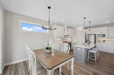 Dining Area - image is of a former model home for visual purposes.