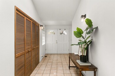 Hallway with coat closet