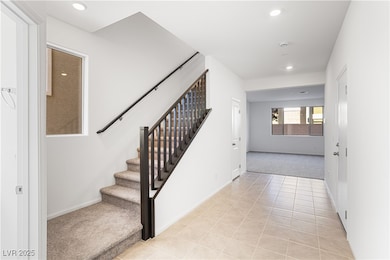 Stairs featuring recessed lighting, carpet flooring, and tile patterned floors