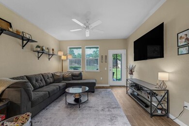 Living area featuring wood finished floors and ce