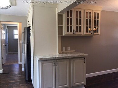 KITCHEN TO THE LEFT AND FORMAL DINING ROOM TO THE