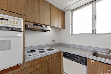 The kitchen includes original appliances and cabinetry, offering a great opportunity to modernize to your taste.