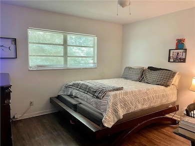 Bedroom with sink, ensuite bathroom, ceiling fan, 