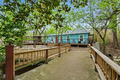 Back of property with a deck