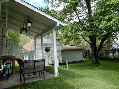 Rear yard and patio shows large lot.