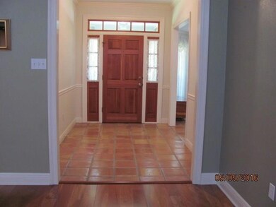 High ceiling,crown moulding in foyer
