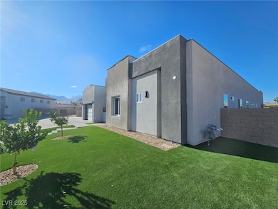 Side view of property with stucco siding and a mountain view