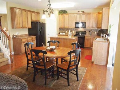 Breakfast. Breakfast room open to kitchen and family room.  Wood floors.
