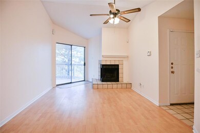 Unfurnished living room featuring lofted ceiling,