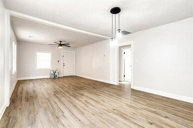 Unfurnished living room featuring light wood-type 