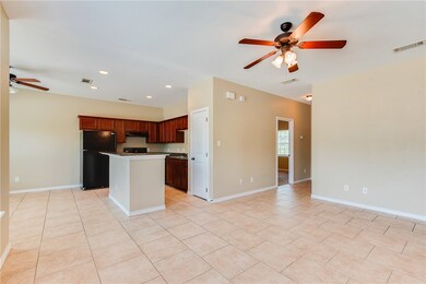 Kitchen featuring freestanding refrigerator, ceili