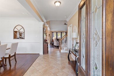 Welcome home to 13826 Bowden Creek Drive! Beautiful front door, tile flooring on diagonal, and crown molding in the entry.