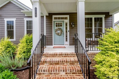 Property entrance with covered porch