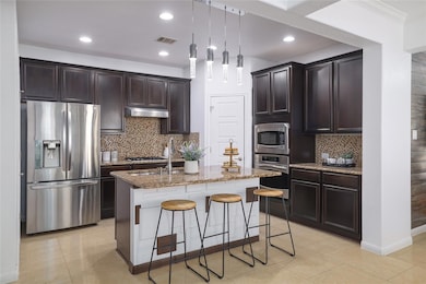 Kitchen featuring decorative backsplash, a kitche