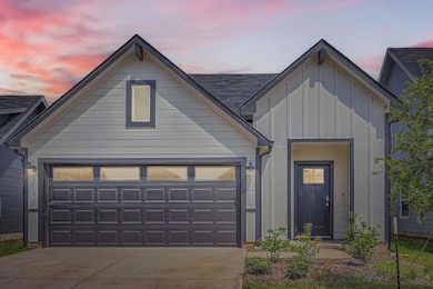 View of front of home featuring board and batten 