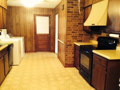 This is a huge kitchen! 11x23! Could hold a huge t