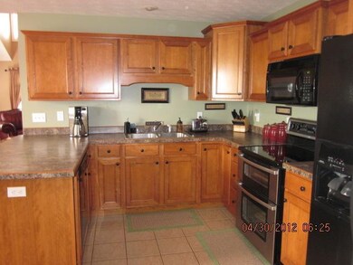 with rich Maple honey cabinets