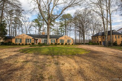 The cobblestone-lined driveway forms a circle with