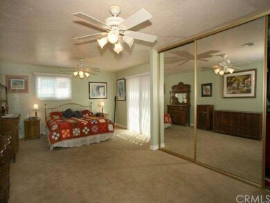 Master bedroom has a vast remodel with a glass slider that opens to the cozy outdoor patio area.  This giant retreat has plenty of room, with large mirrored closets complete with custom shelving.