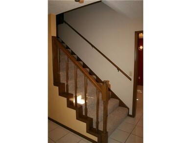 Living Room. Large entry with wide stairway leads 