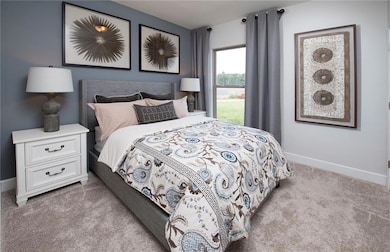 Bedroom with light colored carpet