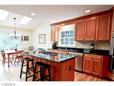 Kitchen - Island has room for seating. Tile backsp