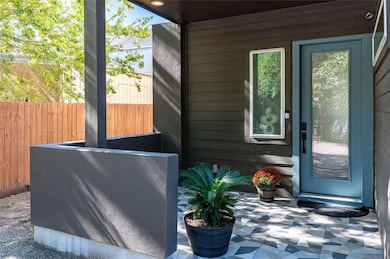 This photo showcases a modern home's entrance with