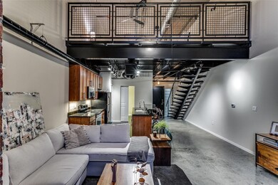 Living room featuring sink and a towering ceiling