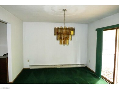 Dining room (with rear deck access) from kitchen.