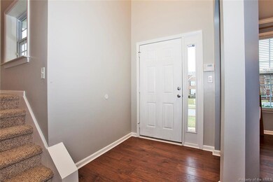 Open foyer, new hardwood flooring, new carpet and 