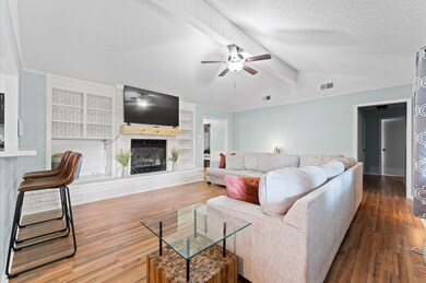 Living Room with Fireplace and raised counter top