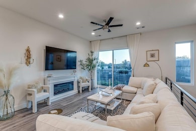 Living room with visible vents, ceiling fan, reces