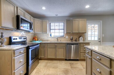 Lovely updated kitchen with multiple prep areas.