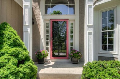 Freshly painted columns, front door and around win