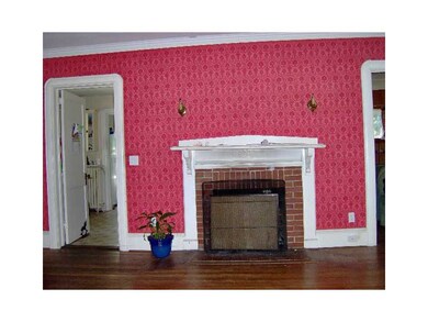 Living Room. fireplace in center of living room.